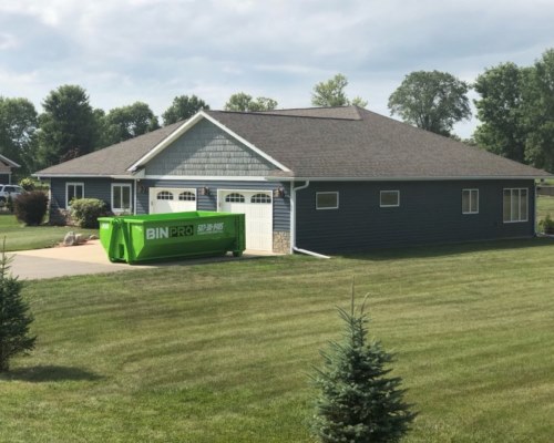 Dumpster in residential driveway