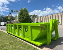 Dumpster in parking lot of event