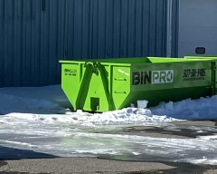 Dumpster outside of industrial building