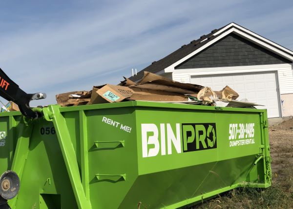 15-yard dumpster filled with cardboard