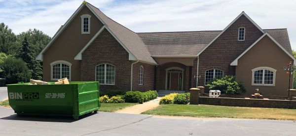 Bin Pro Dumpster in driveway of home.